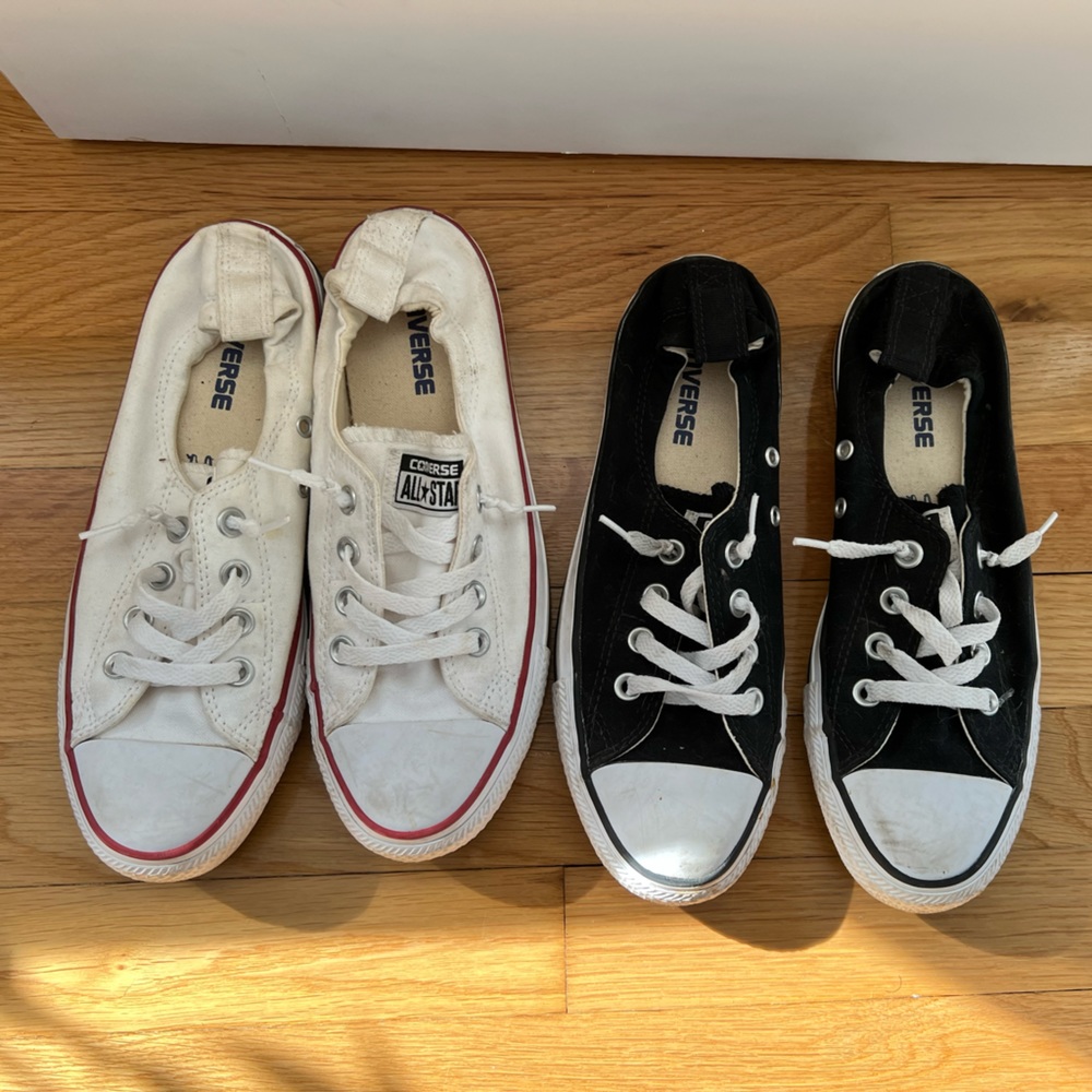 Two pairs of converse. Black and White. Size 8.